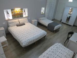 Postel nebo postele na pokoji v ubytování B&B Maison Blanche