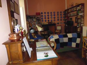 a living room with a table and a couch at Il Platano in Como
