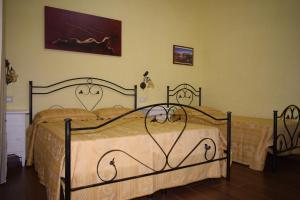 a bedroom with two beds in a room at B&B Vico Napoli Salento in Sannicola +40 photos