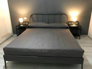 A bed or beds in a room at Sensation House
