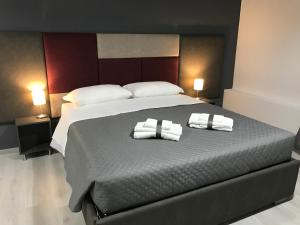 A bed or beds in a room at Sensation House