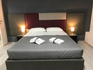 A bed or beds in a room at Sensation House