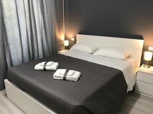 A bed or beds in a room at Sensation House