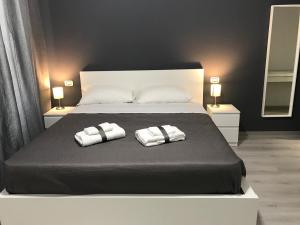 A bed or beds in a room at Sensation House
