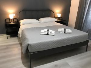 A bed or beds in a room at Sensation House