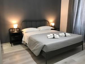 A bed or beds in a room at Sensation House