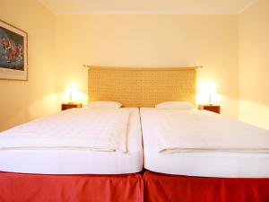 Postelja oz. postelje v sobi nastanitve Hotel Garni Golf