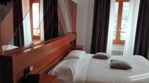 Posteľ alebo postele v izbe v ubytovaní Albergo Ristorante Da Neni