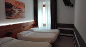 Posteľ alebo postele v izbe v ubytovaní Albergo Ristorante Da Neni