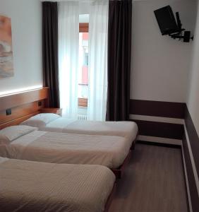 Posteľ alebo postele v izbe v ubytovaní Albergo Ristorante Da Neni