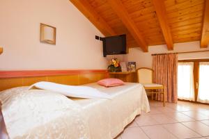 Posteľ alebo postele v izbe v ubytovaní Hotel Ambra