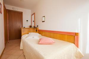 Posteľ alebo postele v izbe v ubytovaní Hotel Ambra
