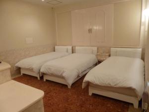 Postel nebo postele na pokoji v ubytování Hotel Sha La La