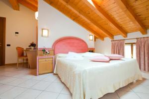 Posteľ alebo postele v izbe v ubytovaní Hotel Ambra