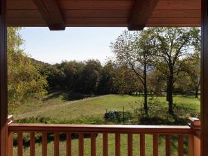 a view of a field from the porch of a cabin at Belvilla by OYO Cascina Paola in Netro