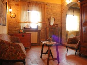 a living room with a couch and a table at Belvilla by OYO Casa Lella in Serrungarina