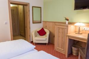 Ein Bett oder Betten in einem Zimmer der Unterkunft Landhotel Windlicht