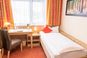 Ein Bett oder Betten in einem Zimmer der Unterkunft Landhotel Windlicht