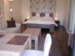 Postel nebo postele na pokoji v ubytování Gonda Apartments