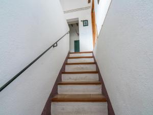 a stairway leading up to a door in a building at Belvilla by OYO El Rac in Pacs del Penedes