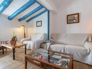 a living room with a couch and a table at Belvilla by OYO El Rac in Pacs del Penedes