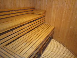 a wooden sauna with two wooden beds in it at Cosy Holiday Home in Strotzb sch with Sauna in Strotzbüsch