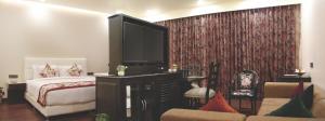 Postel nebo postele na pokoji v ubytování Hotel Grand Maple