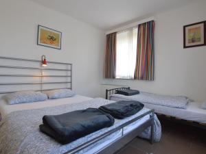 Uma cama ou camas num quarto em Holiday Home in Heppenbach with Garden
