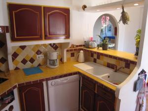 a kitchen with a sink and a counter top at Gorgeous Villa in Bagnols en For t in Bagnols-en-Forêt