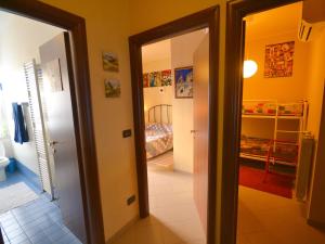 a hallway with a door leading to a bedroom at Belvilla by OYO An apartment near the sea in Finale Ligure