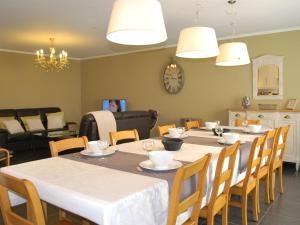 a dining room with a table and chairs at Attractive apartment in Jehonville with terrace in Jehonville
