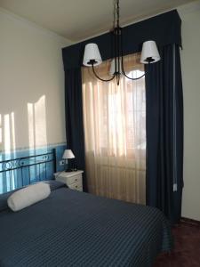 A bed or beds in a room at Chiantirooms Guesthouse