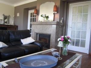 a living room with a couch and a fireplace at Holiday Home in Bouillon in Bouillon