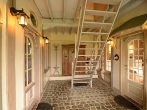 a staircase in a hallway of a house at Charming Holiday Home in Zele near the Forest in Zele