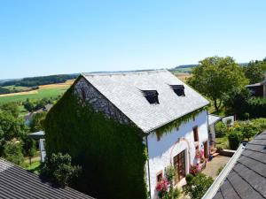 an overhead view of a house with green ivy at Holiday Home in Ittel with Balcony Heating BBQ Parking in Welschbillig