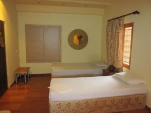 Posteľ alebo postele v izbe v ubytovaní Villa in Giannoudi with Pool and Beach Nearby