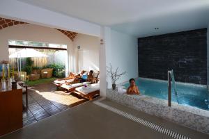 Bazén v ubytování Hotel Las Dunas nebo v jeho okolí