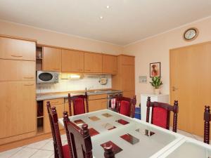a kitchen with a table and chairs in a room at Luxury holiday home in Elend with private pool in Elend