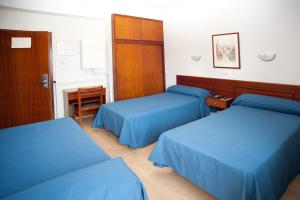 Postel nebo postele na pokoji v ubytování Hotel Roca