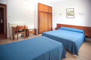 Postel nebo postele na pokoji v ubytování Hotel Roca