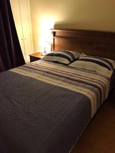 Postel nebo postele na pokoji v ubytování Vista Apartments - Aire Acondicionado y Estacionamiento