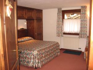 Postel nebo postele na pokoji v ubytování Hotel Petit Giles
