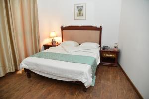 Postel nebo postele na pokoji v ubytování Jess Hotel
