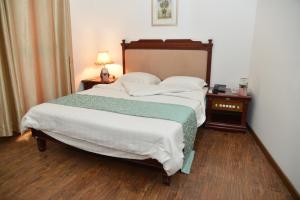 Postel nebo postele na pokoji v ubytování Jess Hotel