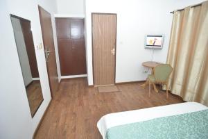 Postel nebo postele na pokoji v ubytování Jess Hotel