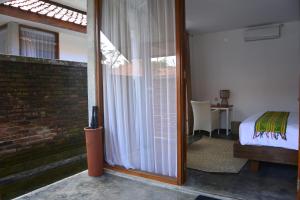 Postel nebo postele na pokoji v ubytování Shankara Borobudur