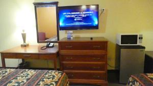 A television and/or entertainment center at Allstate Inn