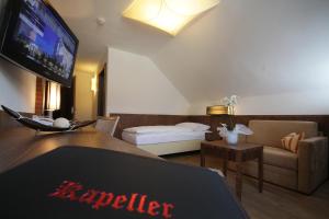 TV a/nebo společenská místnost v ubytování Hotel Kapeller Innsbruck