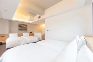 Postel nebo postele na pokoji v ubytování StayB Hotel Myeongdong