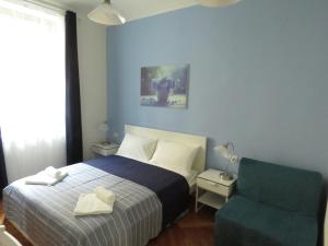 
A bed or beds in a room at Casa Belfiore B&B
